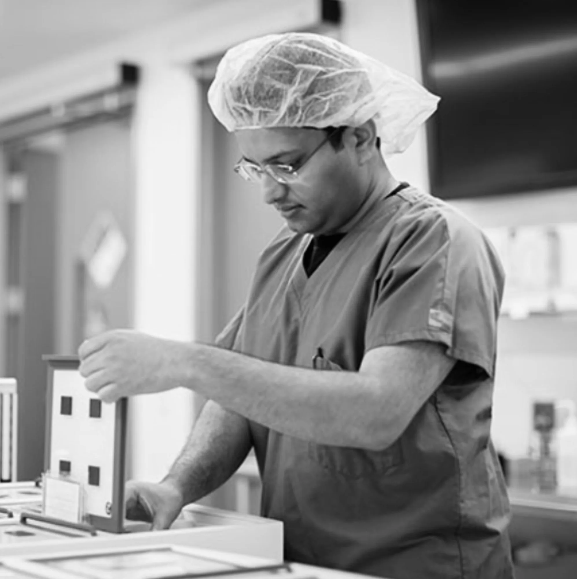 Vik Reddy working at the bench in an IVF laboratory
